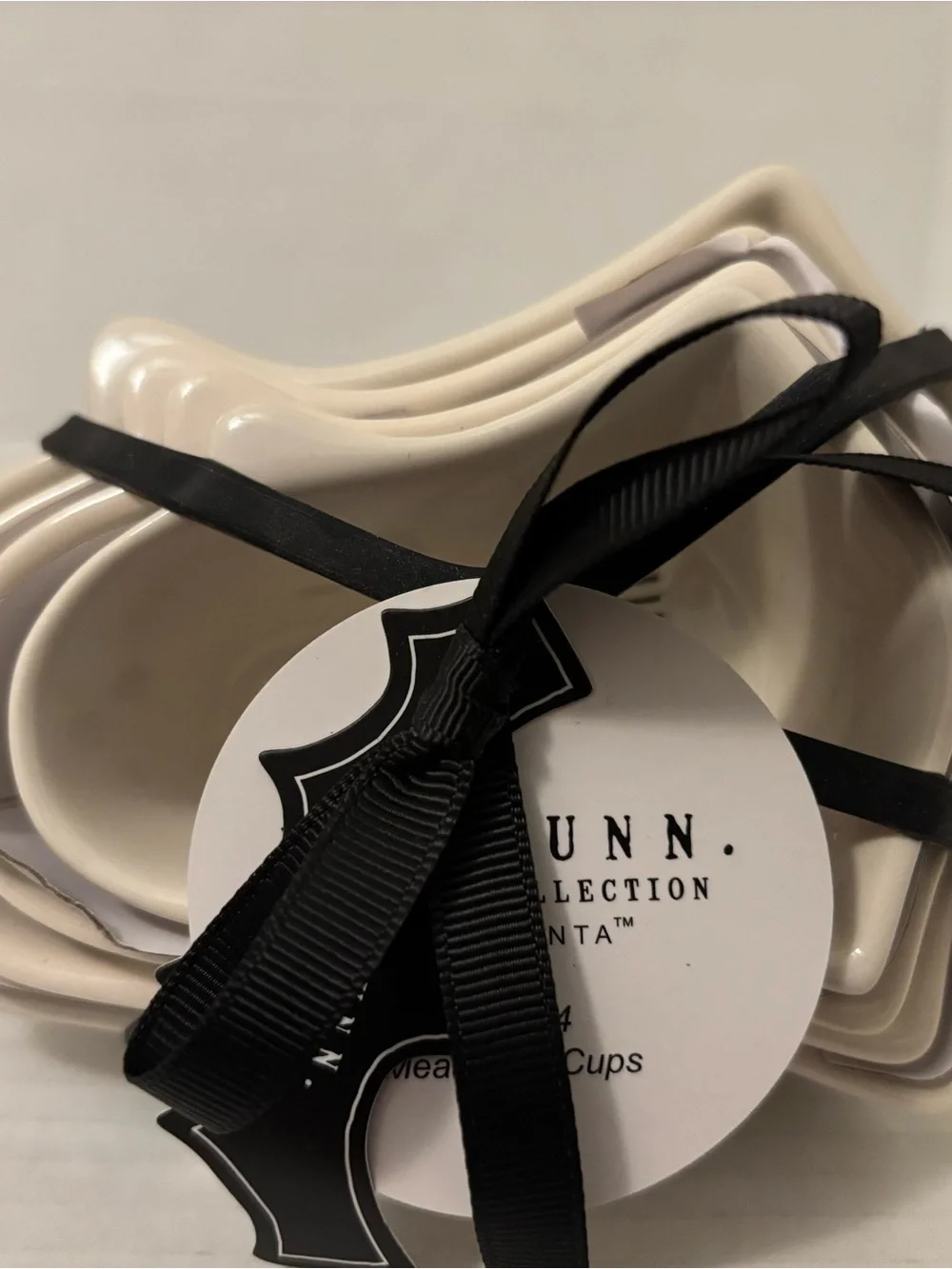 Rae Dunn Cream Ceramic Nested Measuring Cups with Black Ribbon
